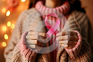 An international awareness day, woman hold pink ribbon cancer awareness. AI generative