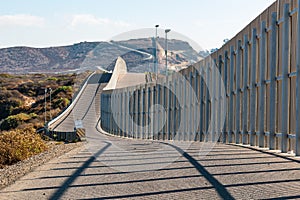 International Border Wall Between San Diego and Tijuana Extending into Distant Hills