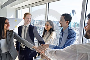 International business team people joining hands together in stack in office.