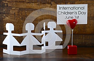 International Childrens Day concept with paper dolls.