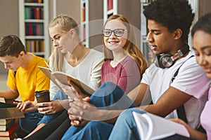 International classmates preparing for exams at library