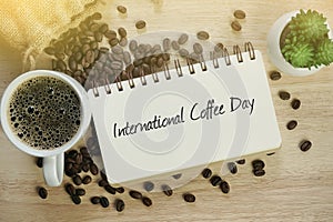 International Coffee Day inscription on the wooden board. International Coffee Day Celebration.