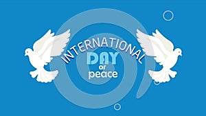 international day of peace lettering with doves flying