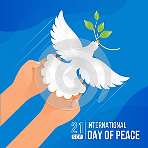 International day of peace - top view hands releasing dove of peace flying into the air on blue background vector design
