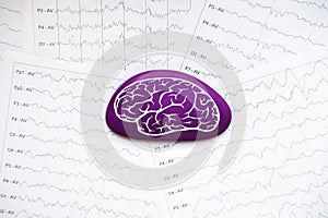 International Epilepsy Day, Epilepsy awareness. Purple brain drawing on brain wave on electroencephalogram EEG for
