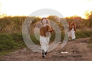 International Family Day. Young mothers, spending time with precious happy child daughter outdoors on summer sunset