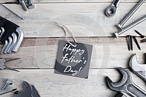 International Father`s Day. Greeting card. Work tools on a gray wooden background