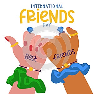 International Friends Day. Two friends with the same jewelry holding hands demonstrate unity and teamwork. People hold