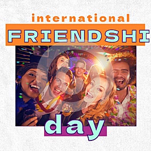 International friendshi day text over happy diverse friends at party in club