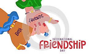 International Friendship Day. Two friends with the same jewelry, holding hands, demonstrate unity and teamwork. People