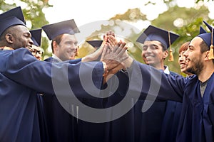 international graduate students making high five