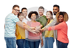 International group of happy people holding hands