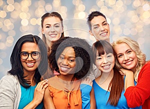 International group of happy women hugging