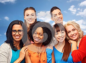 International group of happy women hugging