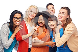 International group of happy women hugging photo