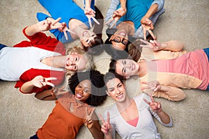 International group of happy women showing peace