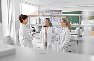 international group of scientists in laboratory