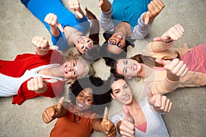 International group of women showing thumbs up