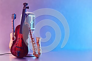 International Jazz Day or World Music day background. Musical instruments on blue background