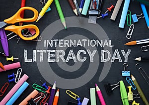 International Literacy Day. School Stationary Top View on Blackboard photo