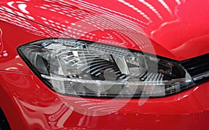 The close up of red car headlight.