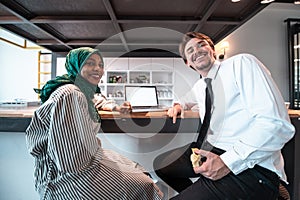 International multicultural business team.A young business man and woman sit in a modern relaxation space and talk about
