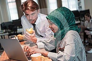 International multicultural business team.A young business man and woman sit in a modern relaxation space and talk about