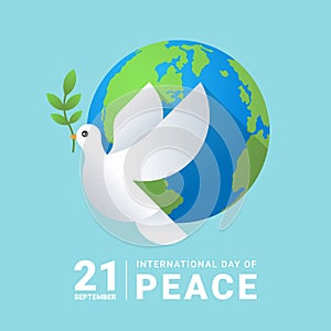 International peace day white dove with leaf and earth world on soft blue background