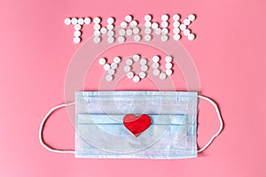 International`s nurses day, week concept, Text Thank you by tablets and red heart on pink background.