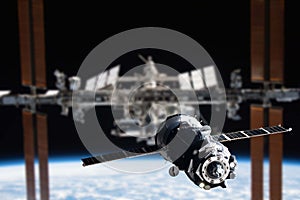 International Space Station in orbit. Docking of the Russian spacecraft. Elements of this image furnished by NASA