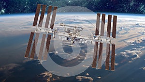 International Space Station over the planet earth. Elements of this image furnished by NASA