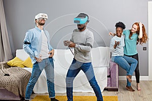 International students enjoying together with glasses of virtual reality home