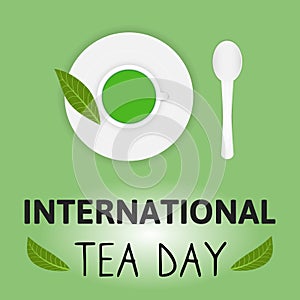 International Tea Day Celebration World on 15th december. Postcard Cup of matcha tea, spoon, saucer plate and tea leaves on green