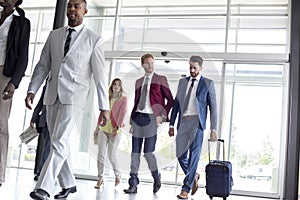 International tourists arrive in airport waiting room