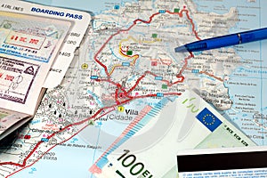 International travel concept. Passport, boarding pass, money, credit card, pen on map of tropic island