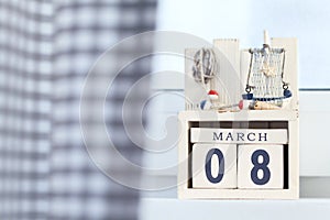 International Woman's Day eight of March wooden cubes calendar with seaside decorations
