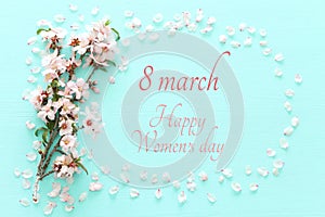 International women day concept. Cherry tree and date text. Top view image.
