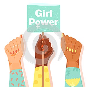 International Women`s Day concept. Woman`s fists showing their power. Girlâ€™s hand holding a nameplates with inscription `Girl p