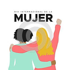 International Women`s Day. 8 March. Spanish. Dia Internacional de la Mujer. Fist hand up. Two women together hugging. Concept of photo