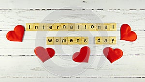 International Women`s Day.words from wooden cubes with letters photo