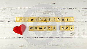 International Women`s Day.words from wooden cubes with letters photo