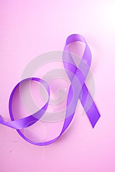 International Womens Day Purple Ribbon Symbol woth lens flare