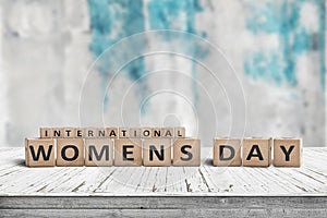 International Womens day sign on a wooden table