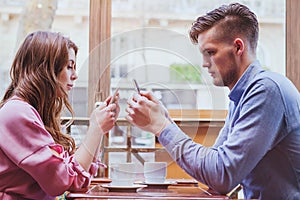 Internet addiction, relationships problem, couple with mobiles