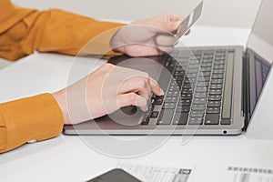 Internet banking, Online shopping at home, asian young woman hand in typing on keyboard, holding credit card, using laptop