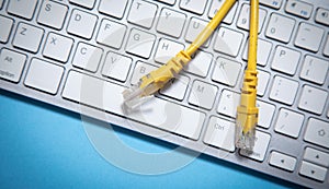 Internet cable on computer keyboard. Internet. Technology