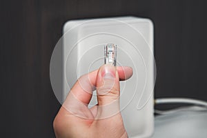 Internet cable, LAN cable kept in hand