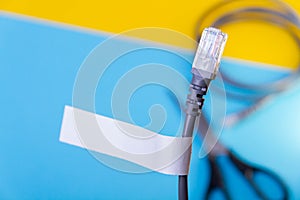 Internet cable and scissors cut it. Disconnection of Internet network. Connection to World Wide Web.