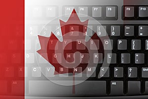 The internet in the Canada with the flag on a black keyboard photo