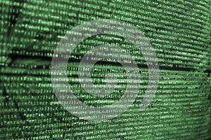 Computer screen with HTML code in green over bkack background.